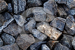 Gray large gravel stones. Background with pile of granite rocks.
