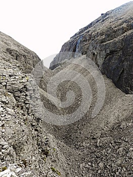 Gray lifeless rocky pass in the mountains.