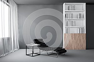 Gray living room with armchair and bookcase