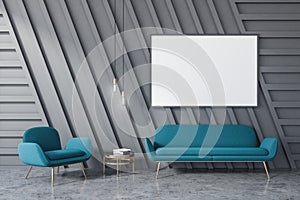 Gray living room, blue sofa and poster