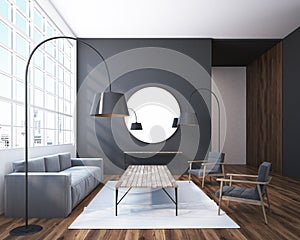Gray living room with a round mirror