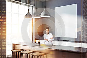 Gray loft kitchen with bar, poster, woman