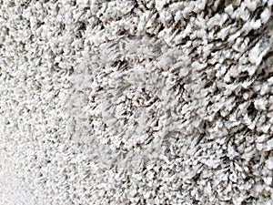 Gray long pile carpet texture background. Polypropylene long pile carpet, close-up