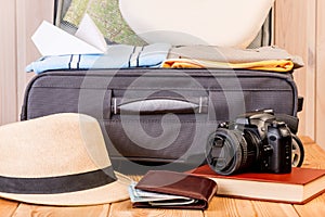 gray male suitcase and accessories for a long journey