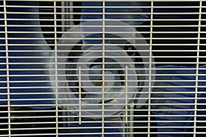 Gray metal texture from the grill on the fan