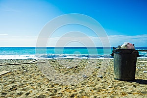 Garbage bin trash can on beach