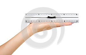 Gray metal ruler with handle. Measuring instrument