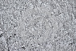 Gray metallic texture of crumpled aluminum foil