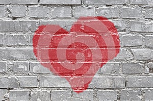 Gray monochrome brick wall background with red heart photo