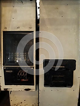 A gray old ATM in the wall. Black frame. Still life in Museum Mandiri.
