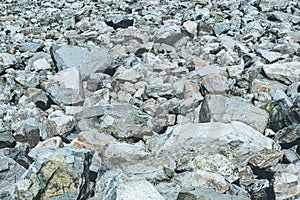 Gray old boulders on hillside. Danger of stone mudslide