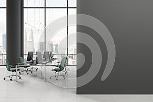 Gray open space office interior with blank wall