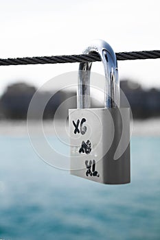 Gray padlock closed on the rope