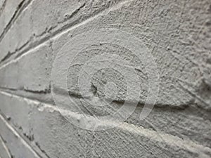 Gray Painted Concrete Wall Receding into Distance Background