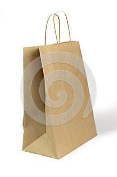 Gray paper bag on a white background. concept of rejection of plastic bags. close-up
