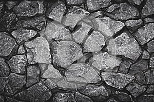 Gray pattern of stone wall background. Abstract gray grunge texture, rocky road. Grey granite surface, floor. Old stone wall, bric