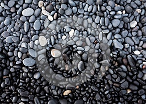 Gray pebbles as a background in the Iceland sea shore. Abstract composition.