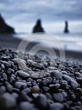 Gray pebbles as a background in the Iceland sea shore. Abstract composition.