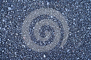 Gray pebbles as a background. Round stones on the beach.