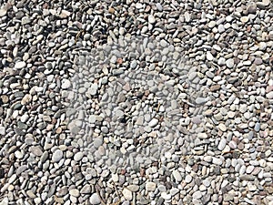 Gray pebbles stone texture and background. Abstract smooth round pebbles sea texture background.