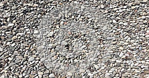 Gray pebbles stone texture and background. Abstract smooth round pebbles sea texture background.