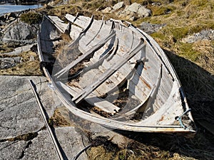 Wooden traditional Norwegian boat on the fjord coast