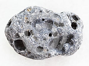 gray pumice stone on white marble background