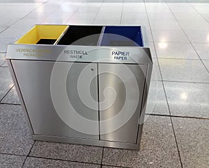 Gray recycle bin, trash bin at the airport