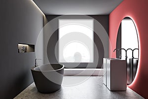 Gray and red bathroom interior with round mirror