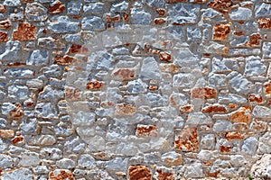 Gray and red stone wall in the mediterranean style texture