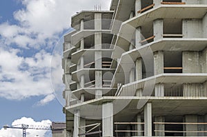 Gray reinforced concrete frame of a new building.