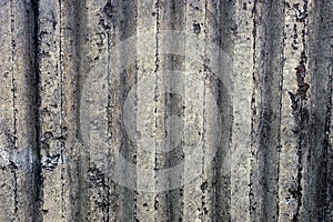 Gray ribbed background of a concrete wall part of a private building