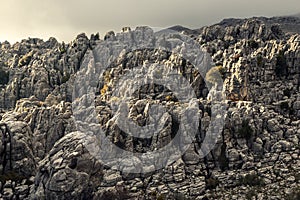 Gray rocky canyon cliff on cloudy day