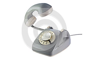 Gray rotary dial phone with flying telephone receiver isolated o