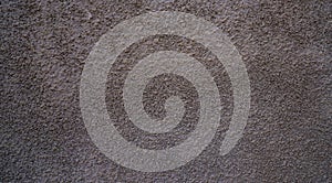 Gray rough plaster wall texture with rustic stucco surface