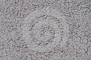 Gray sherpa textured plush fabric material background