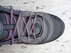 Gray shoes with gray laces with pink dots