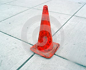 Gray Sidewalk and Orange Cone