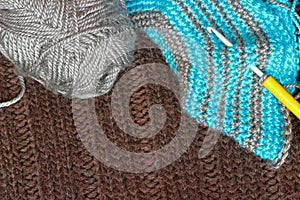 Gray silky yarn with striped crochet hook