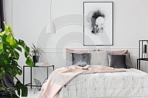 Pink blanket in feminine bedroom