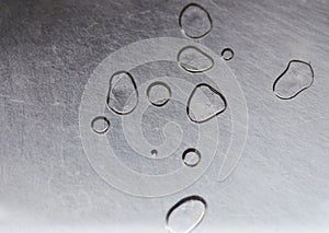 Gray silver metal background with water drops