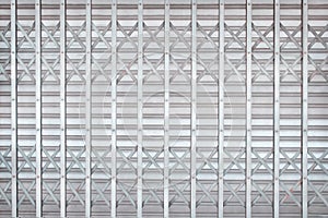 Gray or silver rolling steel door or roller shutter door in interlace patterns for background photo