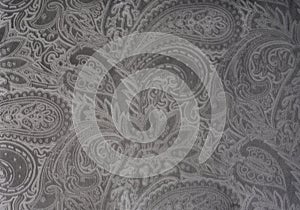 Gray or silver velvet fabric with a vintage elegant floral pattern or a luxury texture.