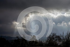 Gray sky before rain with rays of sun in Germany