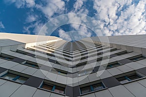 Gray skyscraper in the city berlin block with a beautiful symmetry