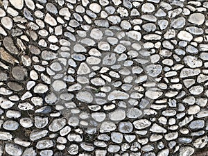 Gray small pebble background, stones as paving ground
