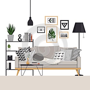 Gray sofa with a coffee table and rack with a floor lamp in Scandinavian style. With pictures, plants and pillows