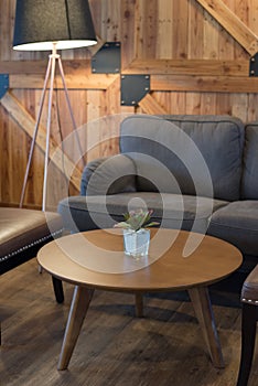 Gray sofa and wooden table in living room, Japanese style.