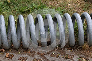 Gray spiraling tubes on the ground at daytime