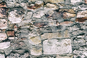 Gray stone background uneven and solid pattern, old stone wall